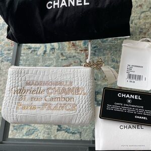 Authentic Chanel White Embossed Leather O-Case wallet pouch